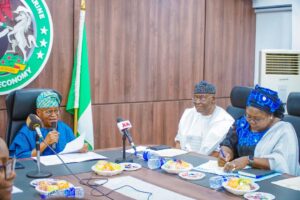 *CAPTION* Honourable Minister of Marine and Blue Economy, His Excellency Adegboyega Oyetola, CON (front row, middle); Permanent Secretary, Federal Ministry of Marine and Blue Economy, Mr. Olufemi Oloruntola (3rd left); Chairman of the Nigerian Ports Authority (NPA) Board, Senator Adedayo Adeyeye (3rd right); Managing Director of NPA, Dr. Abubakar Dantsoho (left) and other Board Members when Oyetola inaugurated the NPA Board in Abuja, on Monday.